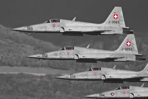 Four Swiss Airforce F-5E II Tiger in formation over lake of Neuchatel, by stemutz